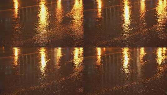 4K灯光映照下的雨夜路面金色涟漪高清在线视频素材下载