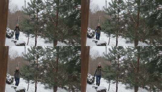 下雪天在山上行走的女人高清在线视频素材下载