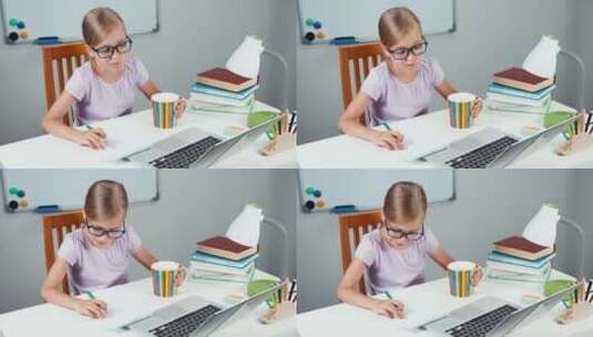 女孩在书桌前用电脑学习高清在线视频素材下载