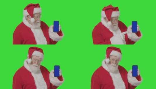 圣诞老人手持蓝屏手机在绿屏前高清在线视频素材下载
