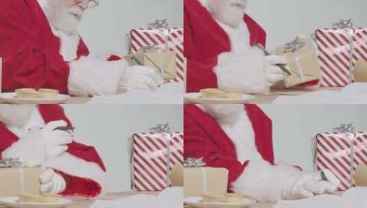 圣诞老人包装礼物高清在线视频素材下载