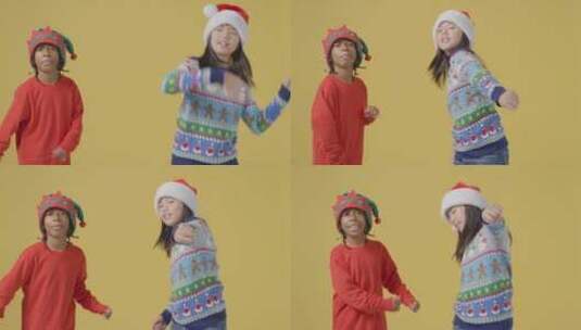 两个穿着圣诞服装的孩子在跳舞高清在线视频素材下载