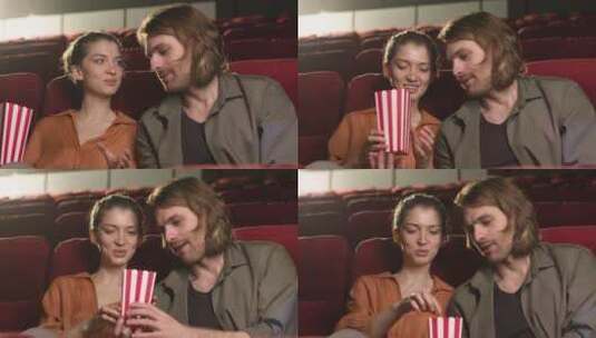 夫妇坐在电影院里吃着爆米花聊天高清在线视频素材下载