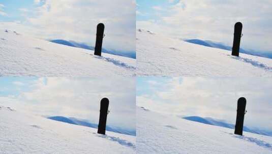 雪山背景的黑色单板滑雪高清在线视频素材下载