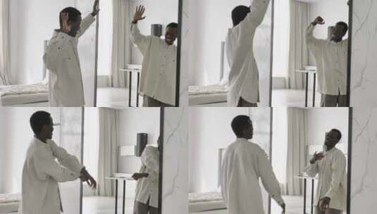 男人穿着衬衫在镜子旁跳舞高清在线视频素材下载