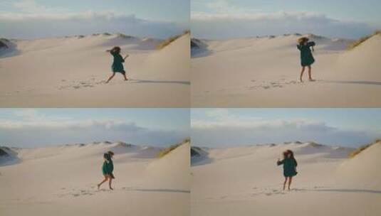 现代舞者在远处表演沙漠沙丘夏日高清在线视频素材下载