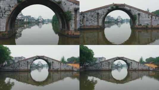 古建筑航拍古镇石拱桥建筑群河流绿水高清在线视频素材下载