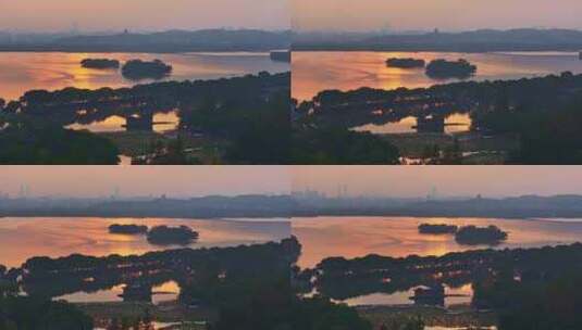 4K航拍清晨的西湖 波光粼粼的金色水面高清在线视频素材下载