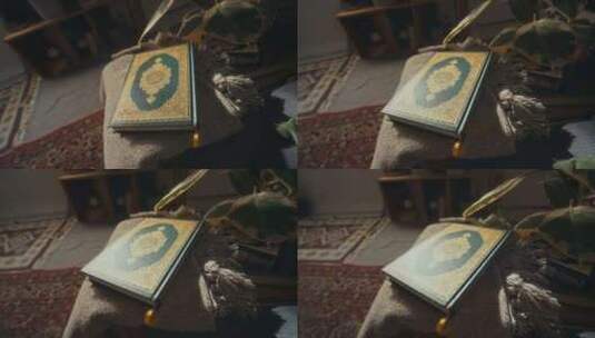 古兰经绿色硬封面，金色装饰品躺在家里的桌高清在线视频素材下载