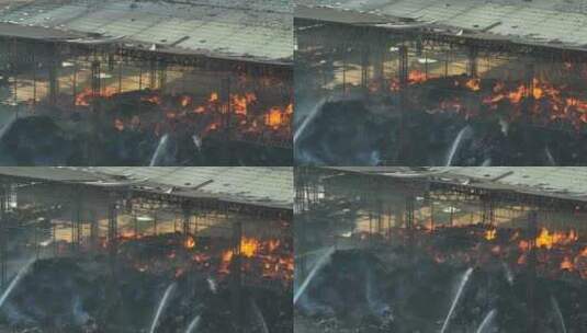 工业火灾，显示广泛的损坏和持续的火焰。高清在线视频素材下载