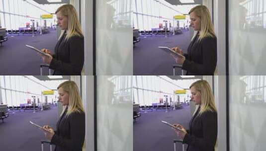 商务女性在机场使用数字平板电脑高清在线视频素材下载