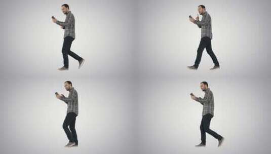 男人走着路使用手机视频通话高清在线视频素材下载