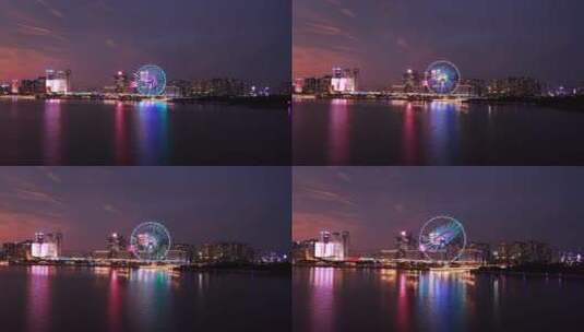 深圳宝安欢乐港湾摩天轮夜景海面前冲高清在线视频素材下载