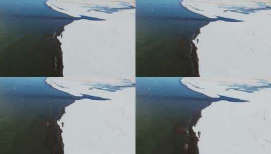青海湖 春季 湖边 雪景 航拍 光线 湖水高清在线视频素材下载