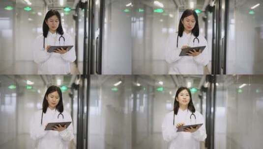 年轻女医生在办公室使用平板工作高清在线视频素材下载