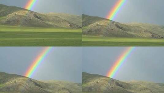 航拍山脉草原与彩虹高清在线视频素材下载