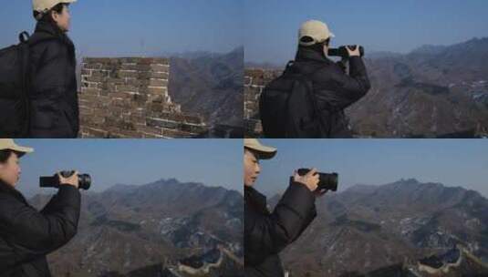 中国女性站在长城顶端拍摄风景高清在线视频素材下载