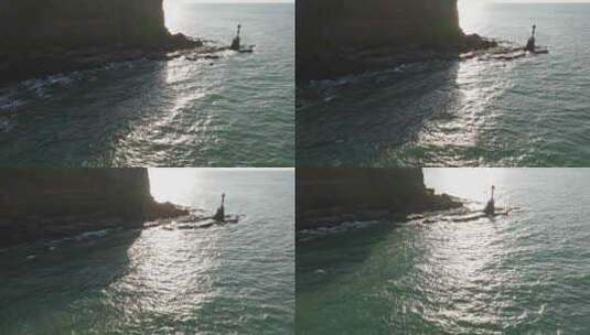 航拍涠洲岛山崖下的海角灯塔高清在线视频素材下载