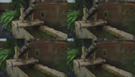 传统竹制喷泉与雨滴高清在线视频素材下载