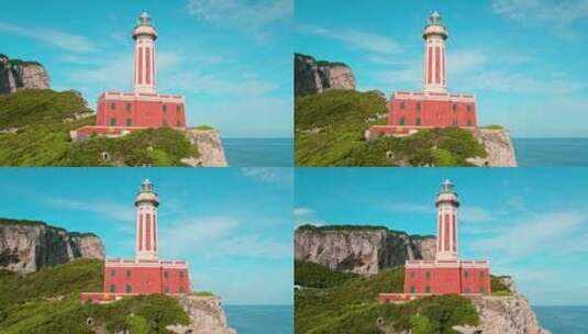 灯塔矗立在悬崖顶上，它的红色立面与郁郁葱高清在线视频素材下载