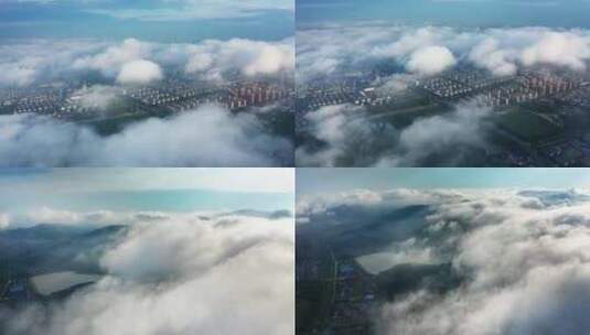 平流雾 云上看城市 云雾飘过城市高清在线视频素材下载