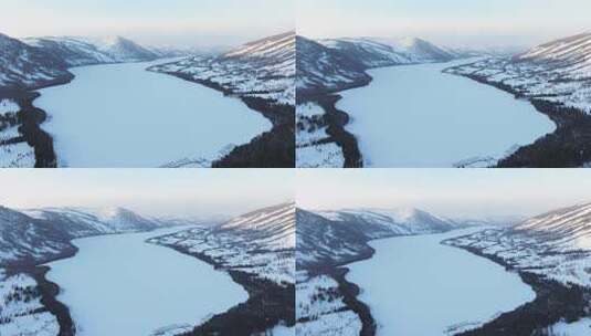 航拍新疆冬季喀纳斯湖雪景雪山森林冰河寒冷高清在线视频素材下载