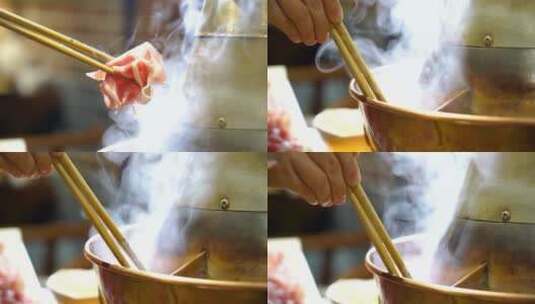 冬季火锅从火锅里夹起涮肉高清在线视频素材下载