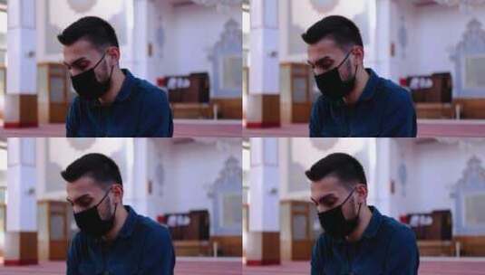 戴口罩的男人在清真寺忏悔高清在线视频素材下载