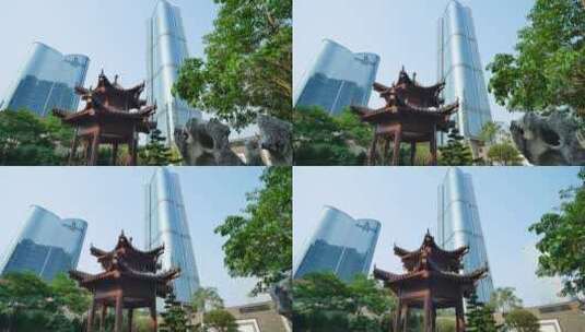 广西南宁现代化城市高楼中的传统园林庭院高清在线视频素材下载
