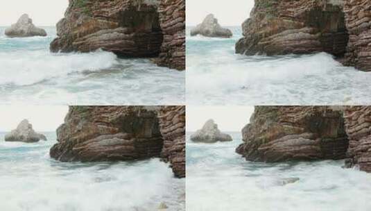 波涛汹涌的大海在岩石上掀起波涛高清在线视频素材下载