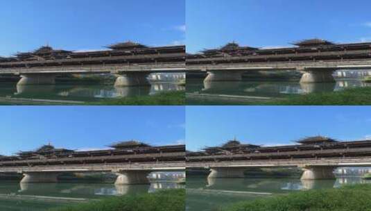 下降拍摄蓝天白云下的湖北省恩施州宣恩县侗族风雨桥高清在线视频素材下载