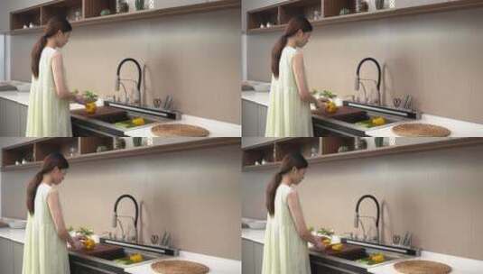 模特下厨房切黄色辣椒切菜集成水槽切菜高清在线视频素材下载