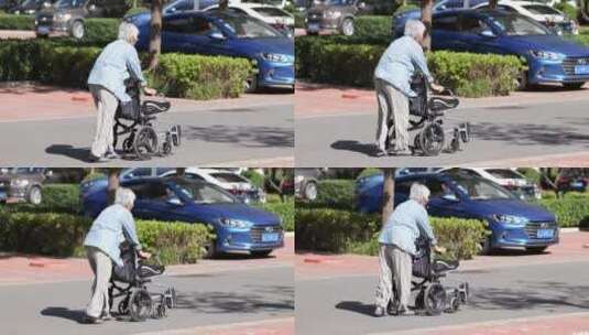 行动不便推着轮椅的老人高清在线视频素材下载