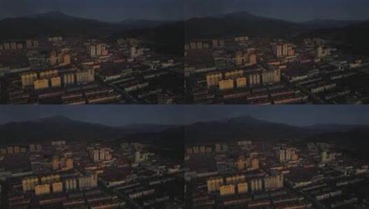 航拍夕阳照耀下的小城镇高清在线视频素材下载