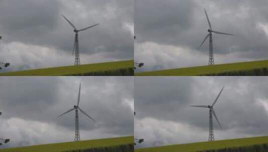 乌云下的风力发电机高清在线视频素材下载