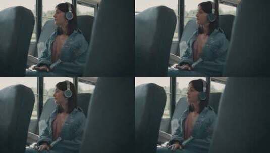 公共汽车里听音乐的女孩高清在线视频素材下载