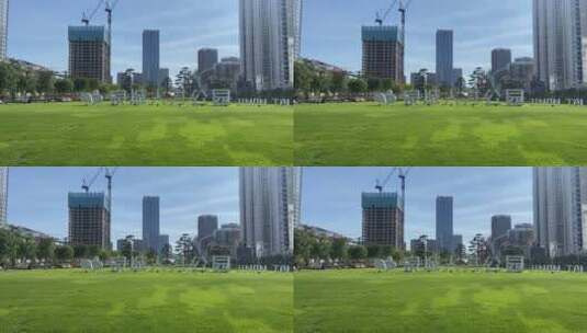 济南泉城人才公园，粉黛花海、城市绿的草坪高清在线视频素材下载