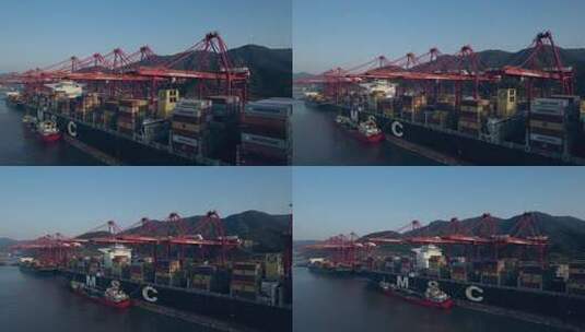 夕阳下航拍宁波北仑集装箱码货轮装卸高清在线视频素材下载