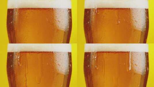 啤酒在玻璃杯中冒泡的特写镜头高清在线视频素材下载