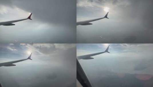 飞机在阳光和云层下飞行高清在线视频素材下载