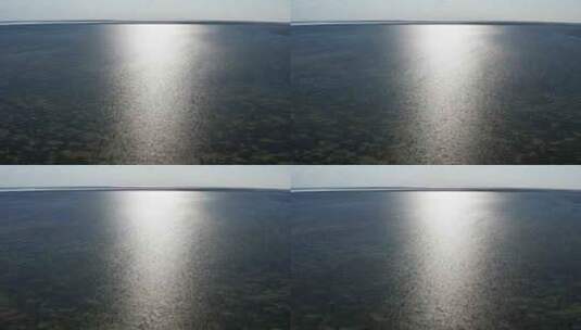 大海的俯视图。阳光反射在海水中。高清在线视频素材下载