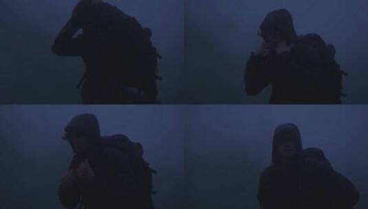 在山顶迷雾中行走的男子高清在线视频素材下载