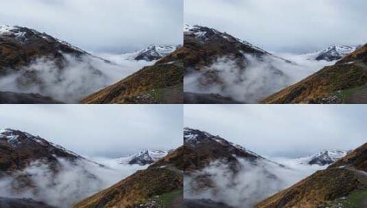 山间云雾缭绕的雪山风景高清在线视频素材下载