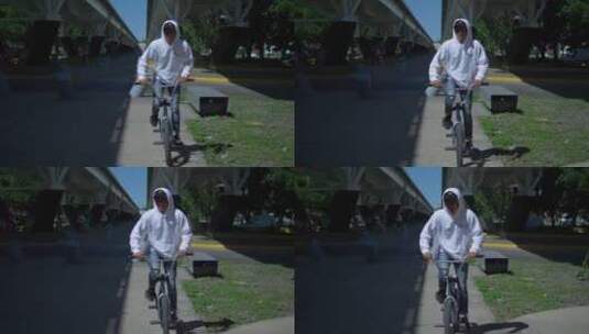 男子在吊桥下骑自行车高清在线视频素材下载