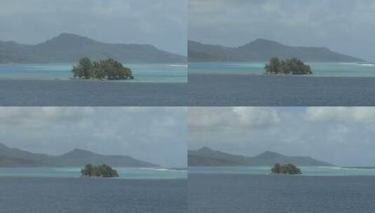 山脚下的大海里的岛屿景观高清在线视频素材下载