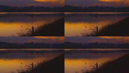 4k夕阳下江边钓鱼的男人高清在线视频素材下载