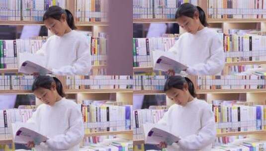 4K升格实拍站在图书馆书架旁看书的女孩高清在线视频素材下载