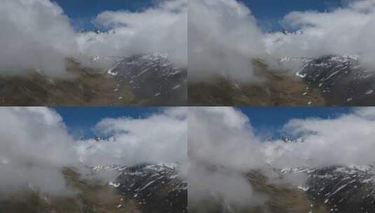 白雪皑皑和云雾弥漫的山脉高清在线视频素材下载
