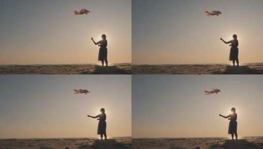 女人带着风筝的剪影高清在线视频素材下载