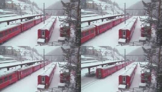 雪天在铁轨上的行驶的火车高清在线视频素材下载